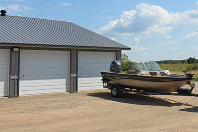 Boat Storage | Fishing boat in front of a storage unit at Strack's Self Storage in Randall, MN